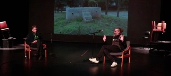 The two conversants on stage